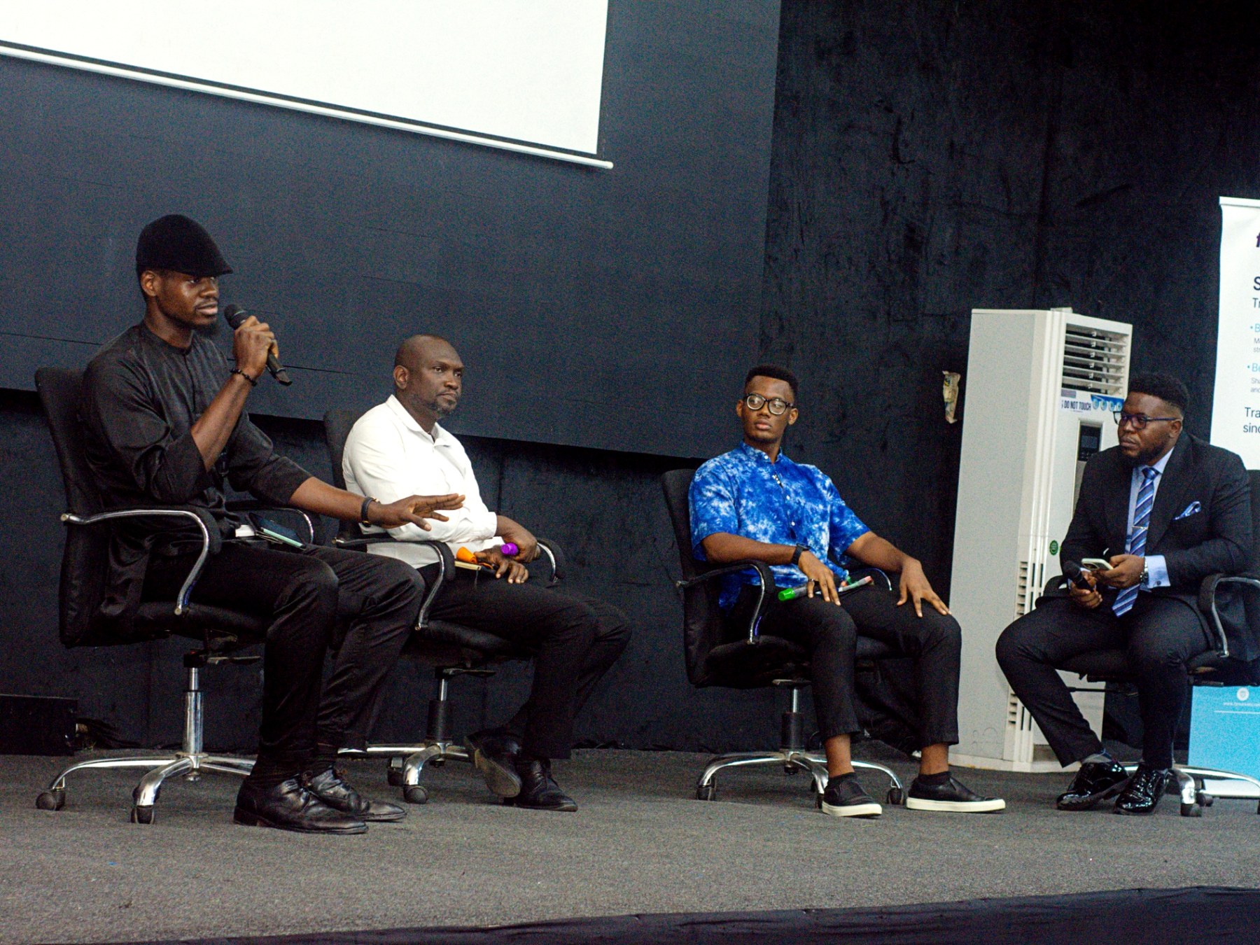 Joshua C. Okereke speaking on a panel in Alausa, Ikeja